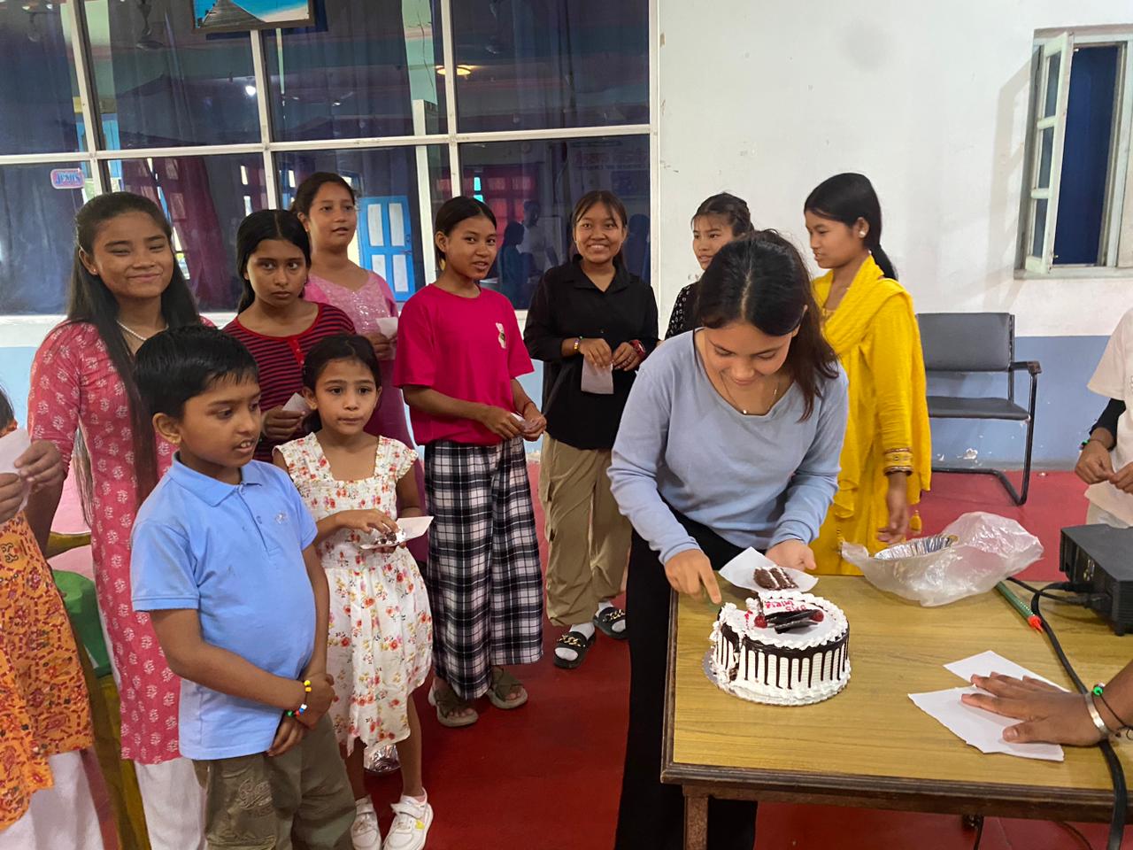 Nepal girls eating cake 13 2024-07-13 at 1.09.40 PM