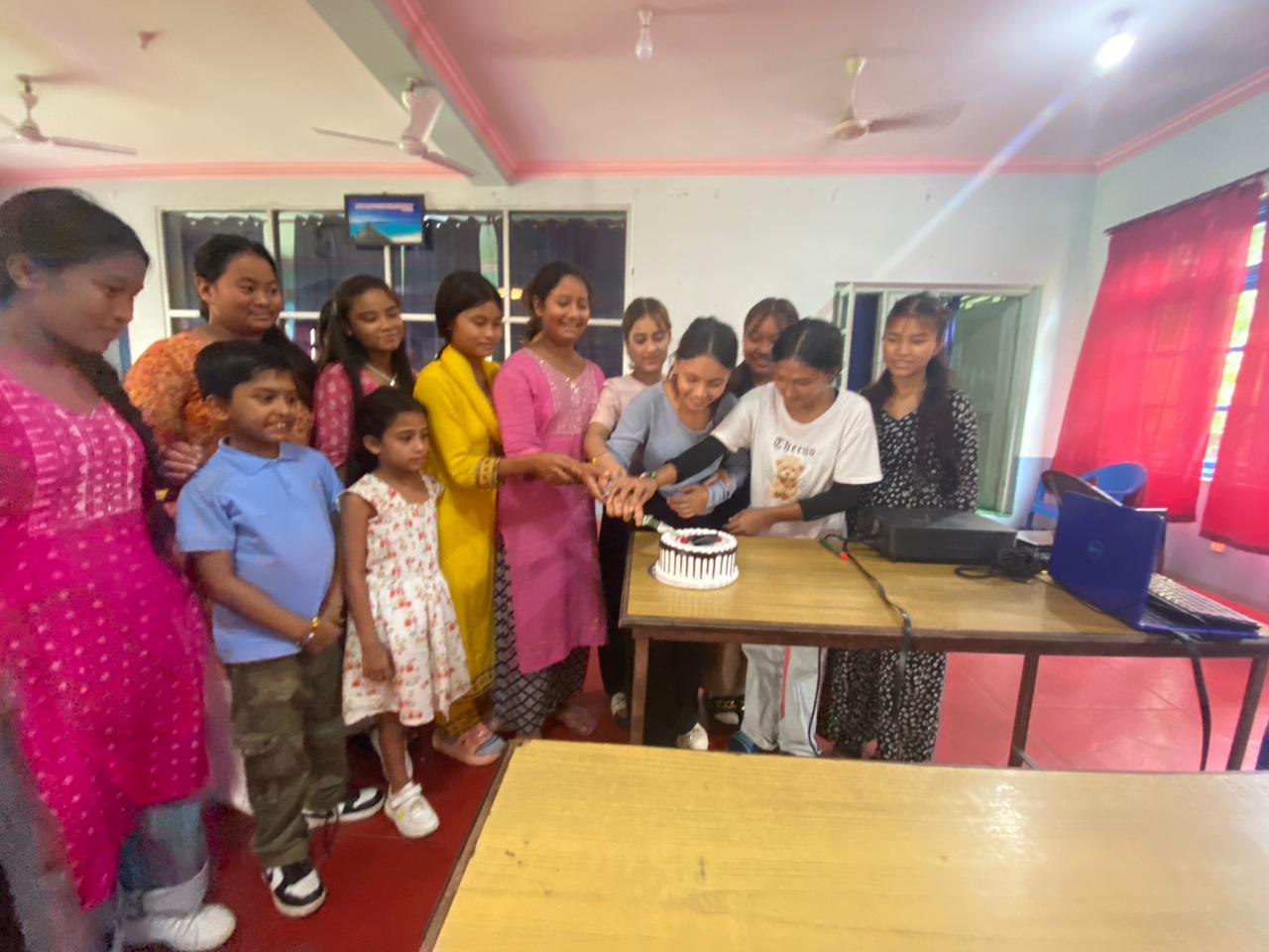 Nepal girls eating cake 16 2024-07-13 at 1.09.42 PM