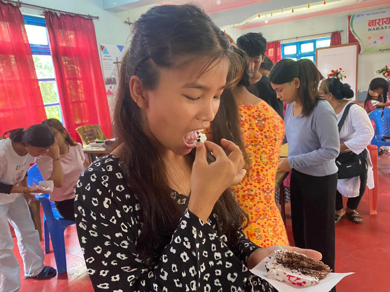 Nepal girls eating cake 9 2024-07-13 at 1.09.37 PM